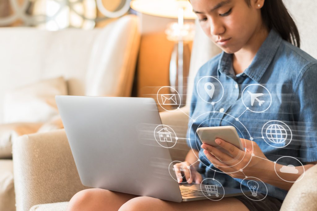 young woman with multiple devices